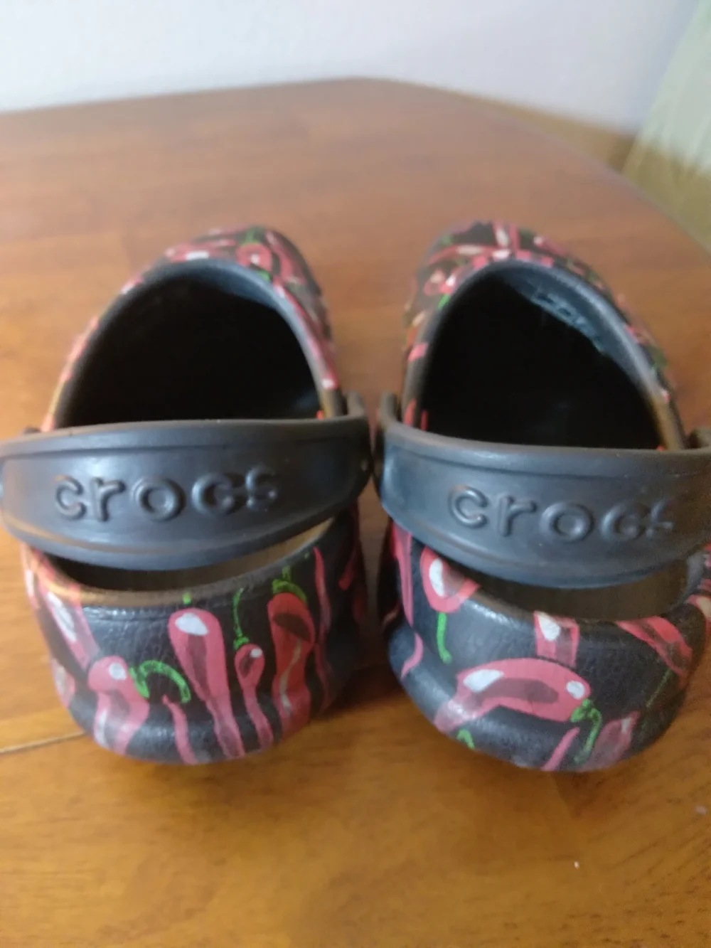 CROCS Kids Chili Pepoer Print Clogs in Black and Red